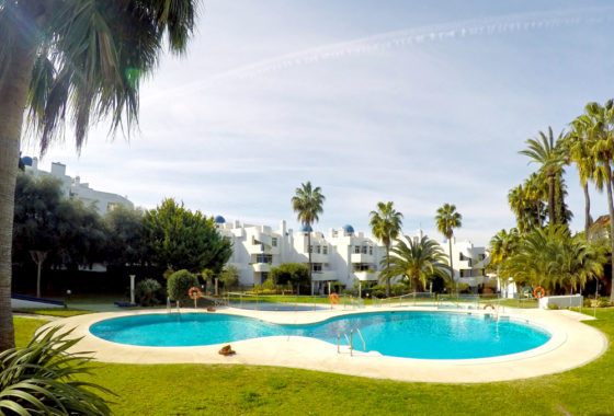 Pool area of apartment for sale in Calahonda Spain
